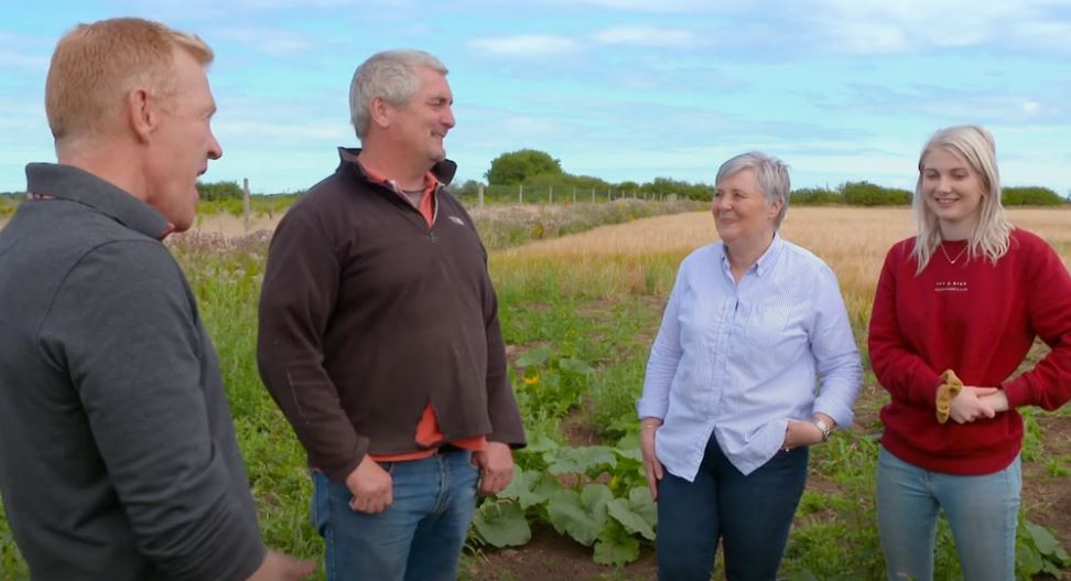 Adam henson with family in pumpkin field